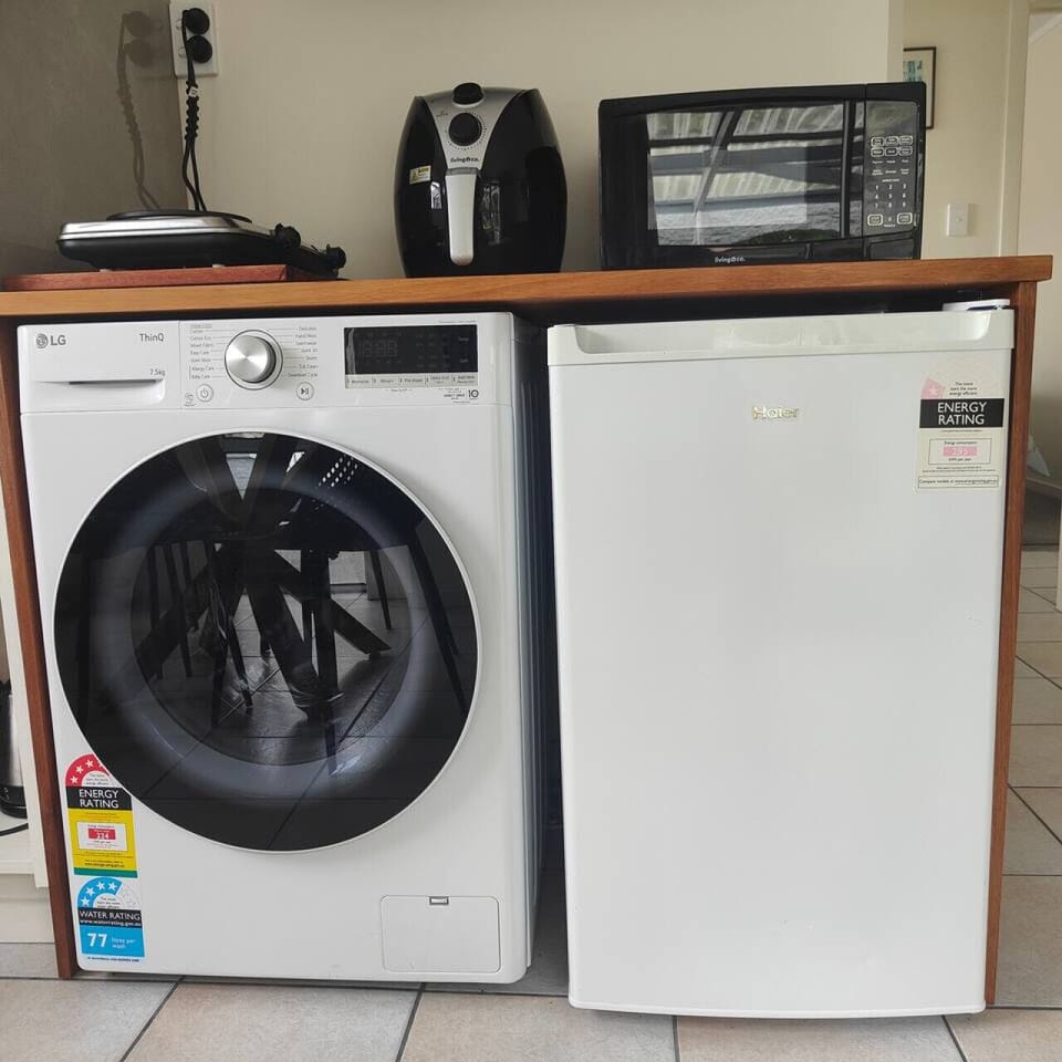 KItchen/dining area - washing machine and fridge
