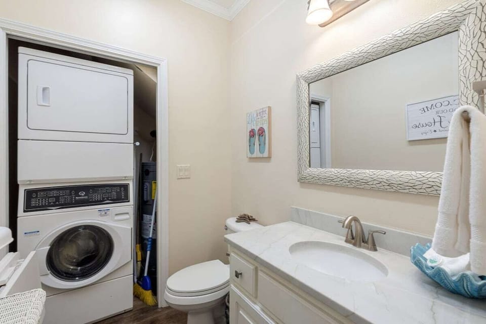 First floor half bathroom with washer/dryer