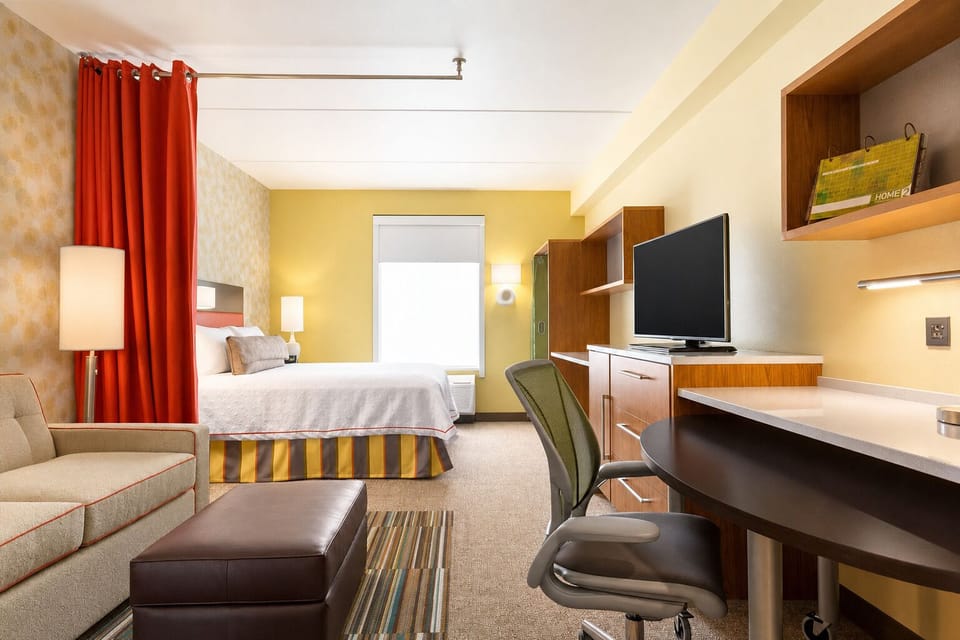 Work comfortably at the desk, then relax with in-room TV.