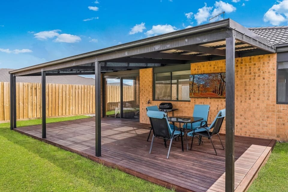 Fully fenced backyard with BBQ and undercover seating area.