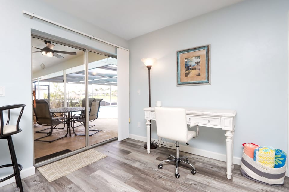 A tranquil spot to catch up on work or journaling, with views of the covered lanai just beyond