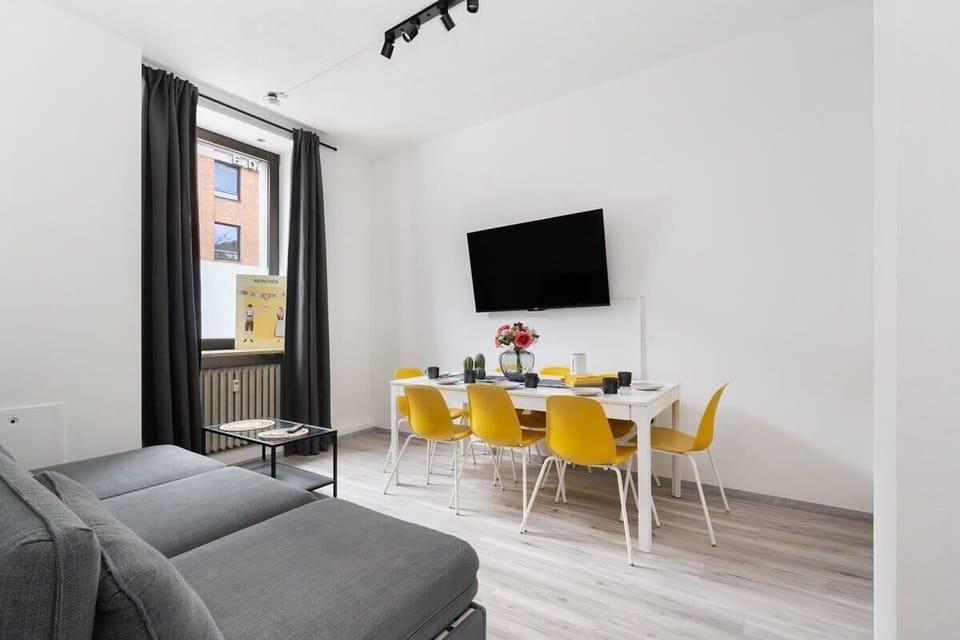 Living Area with Dining Table and Smart TV