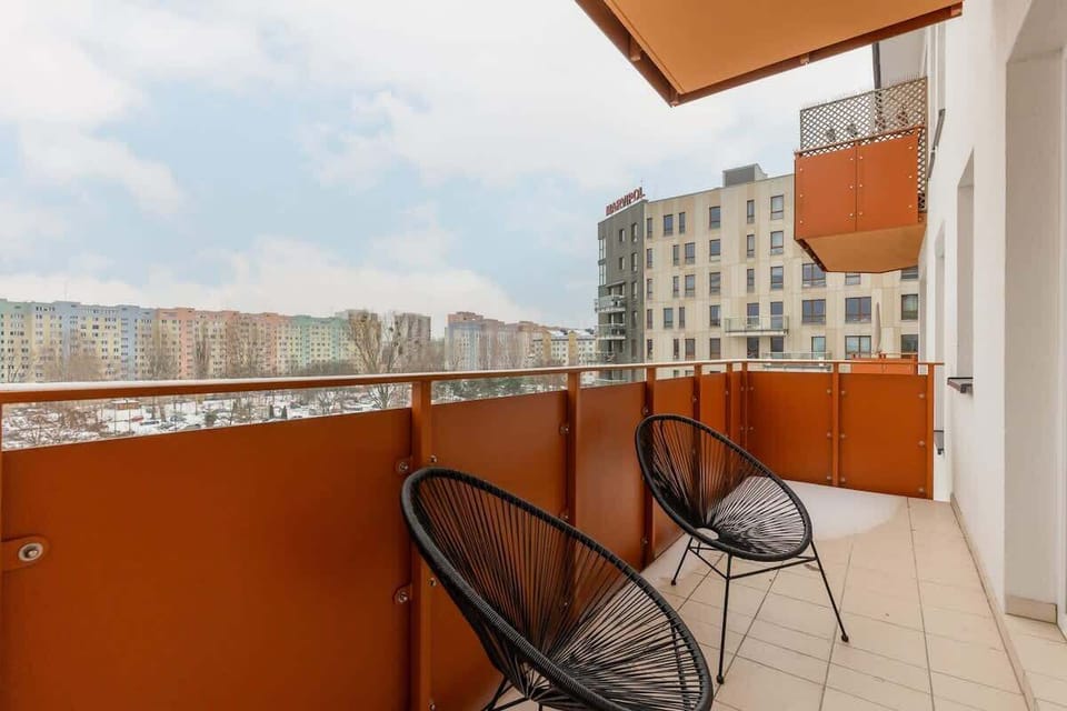 The balcony provides a perfect spot for enjoying the fresh air. 