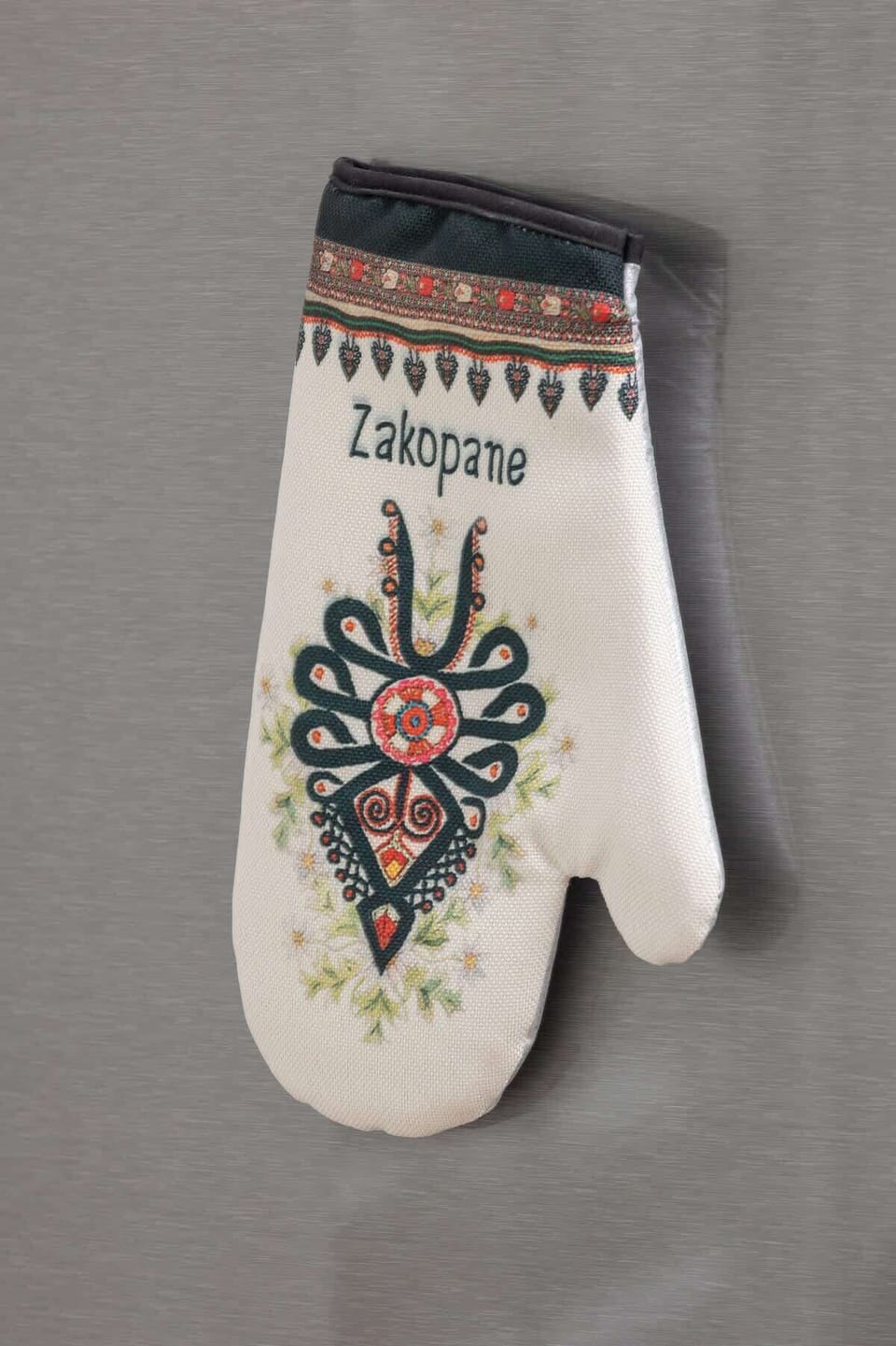 A close-up of a traditional decorative mitten, adding a touch of local culture and charm to the apartment.

