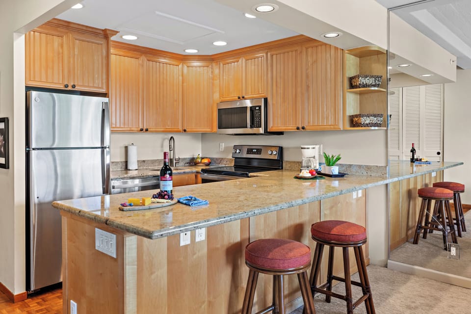 Fully equipped kitchen with a generous breakfast bar, comfortable seating, and modern appliances. Ideal for casual dining or enjoying your morning coffee before a day in paradise.