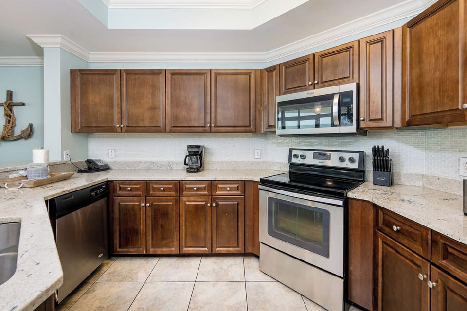 Craft delightful meals in this inviting kitchen featuring stainless appliances for culinary inspiration