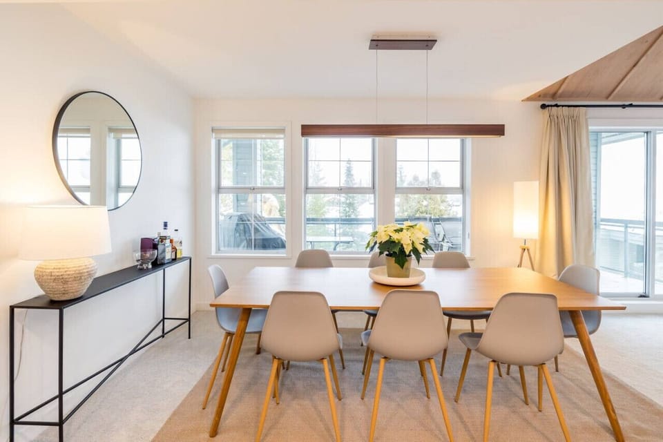 Step into our inviting dining space for 8! Bask in the cheerful vibes as sunlight floods in through the huge window, giving you a peek at our patio deck. Step outside and find a BBQ and plenty of seats for Al Fresco dining.