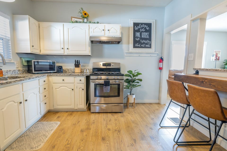 View of the kitchen highlighting the breakfast bar. 