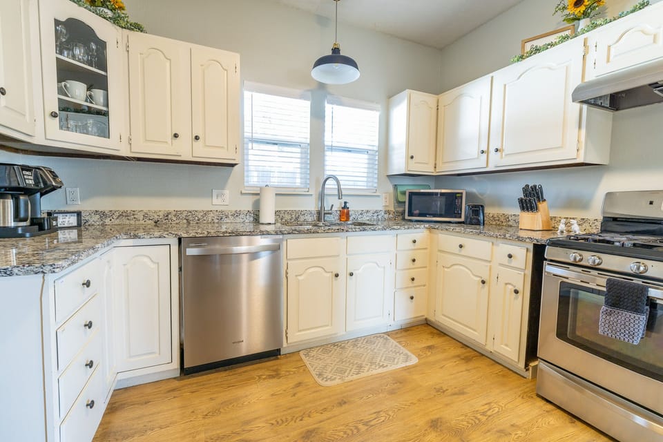 Large dishwasher and stove in the kitchen. 