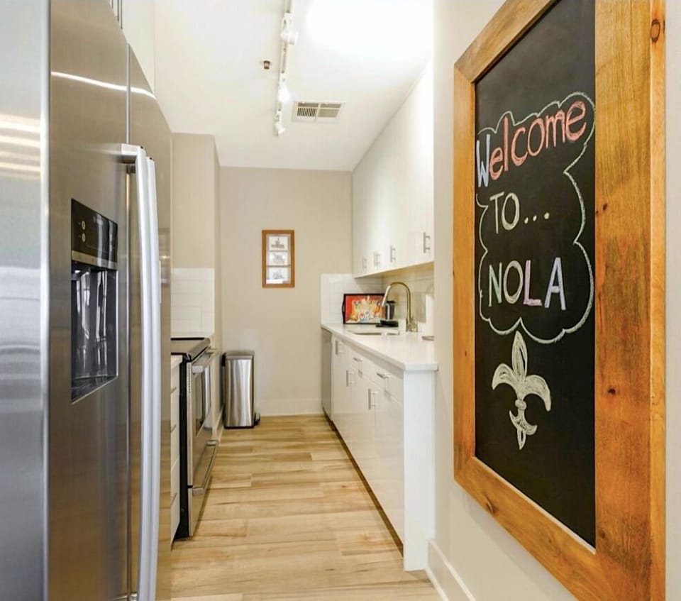 Fully stocked high-end kitchen with all of the essentials! Topped off with a supersized chalkboard to sketch and notate on.