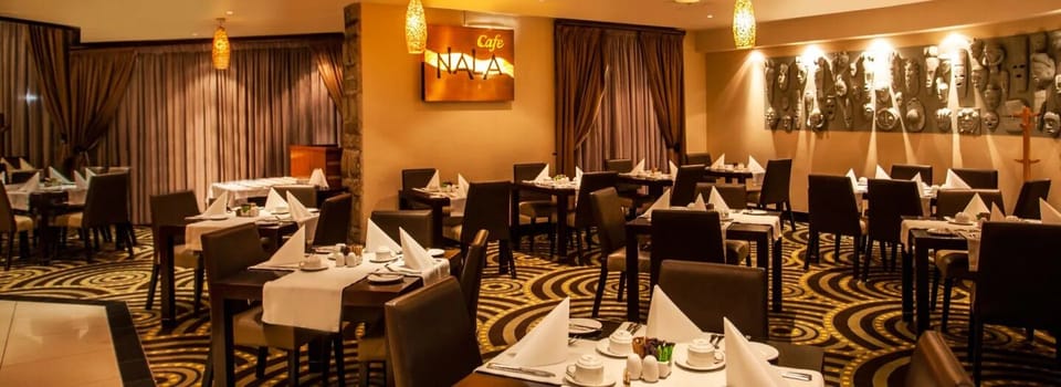 Savor a relaxed meal in warm, elegant dining comfort.