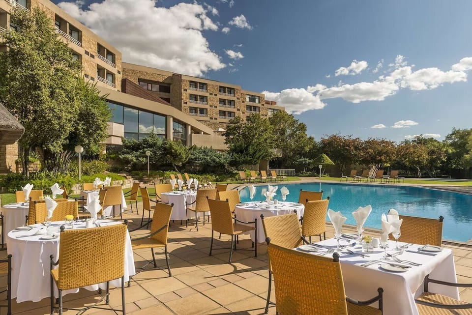 Bask in sunny poolside relaxation with crisp linens and views.