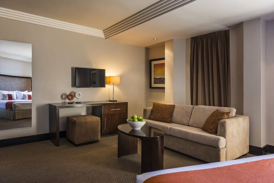 Unwind on the plush sofa after a day exploring.