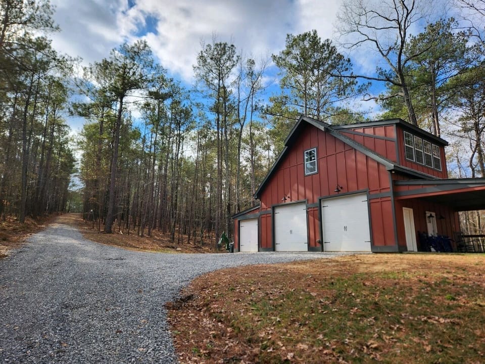 Located down a tree-lined dirt and gravel driveway, shared with the main house.