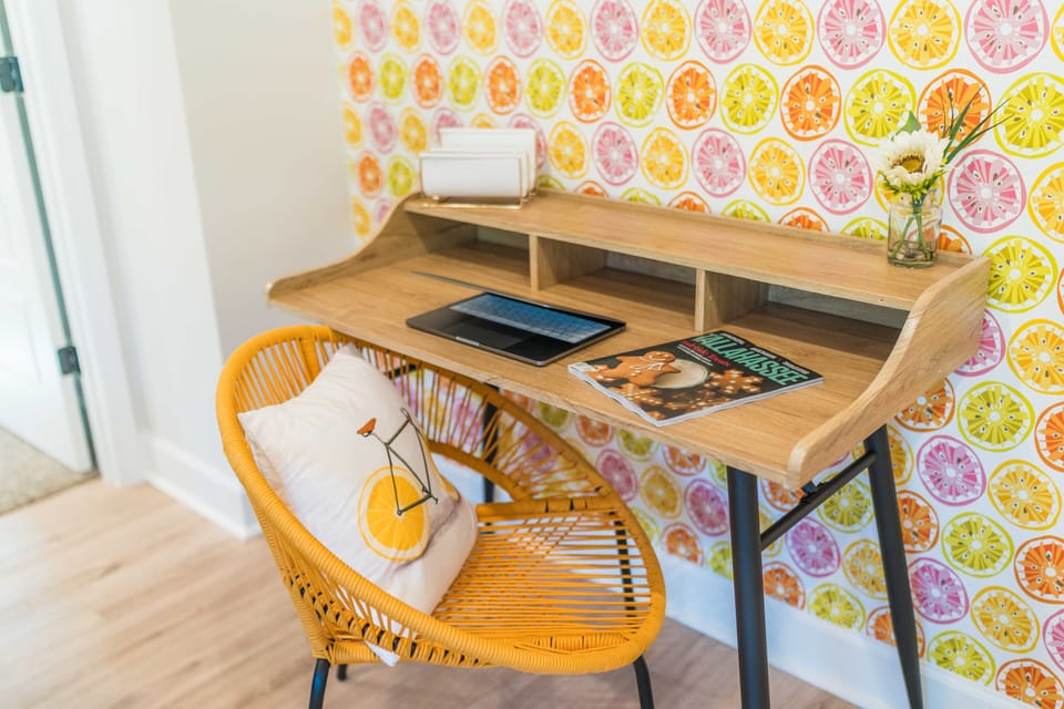 There is a plush seat for the workspace