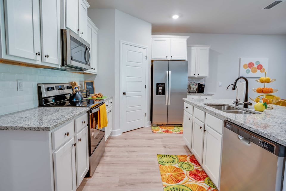 Fully equipped kitchen with modern appliances and spacious countertops