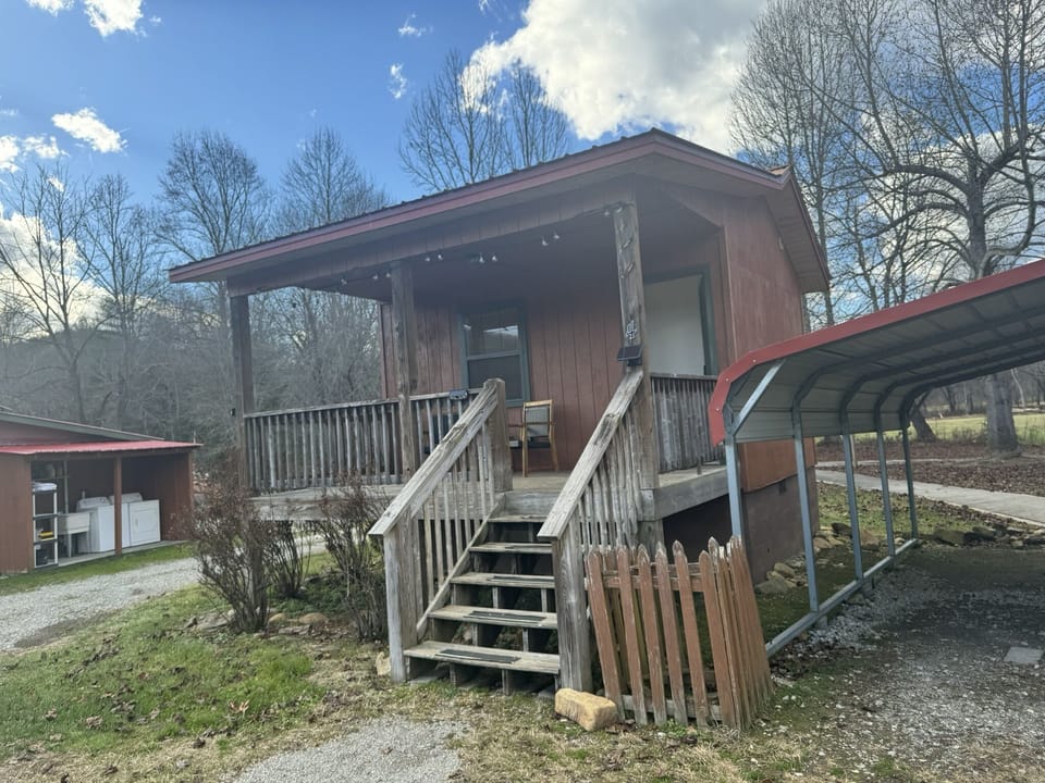 Each Cabin offers an inviting front porch with seating to enjoy the view