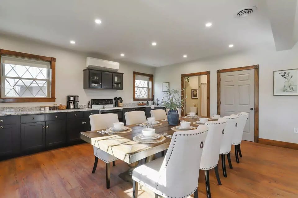 Kitchen, dining table for 8 and full-sized bathroom in the back
