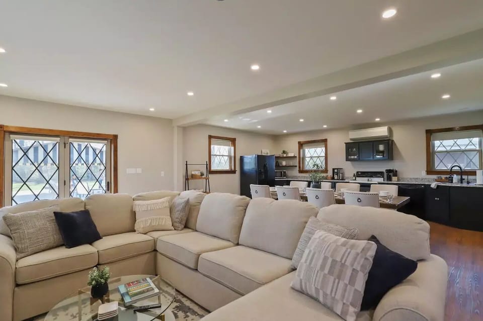 Large kitchen-dining-living room with an exterior door leading to the patio
