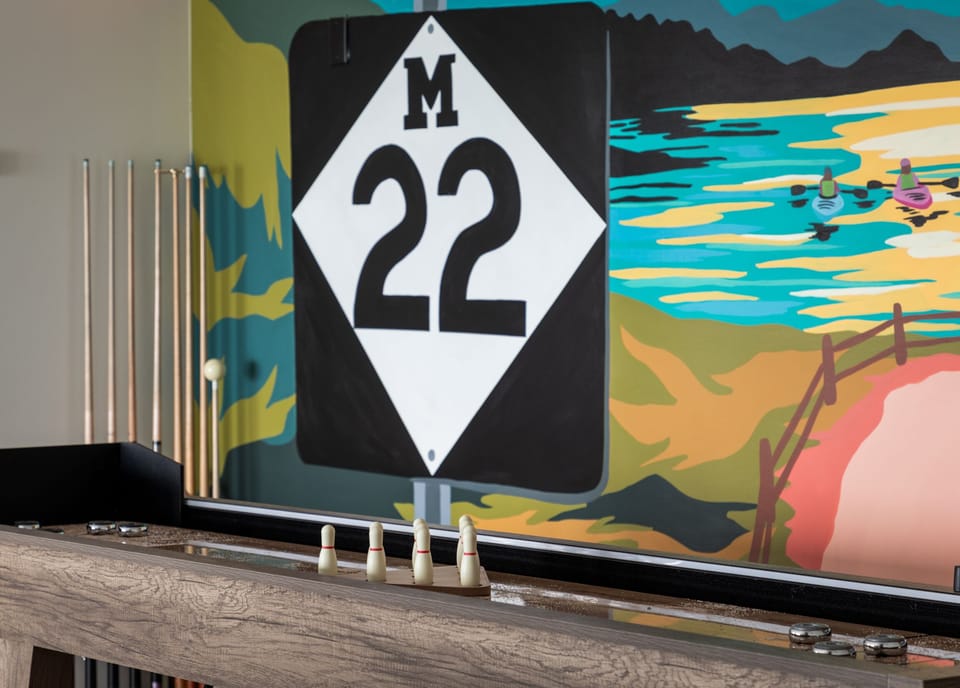The moment you walk into White BIrch, fun awaits! This stunning mural capturing the essence of the famous M22 highway, invites family and friends to gather, play, and create cherished memories.