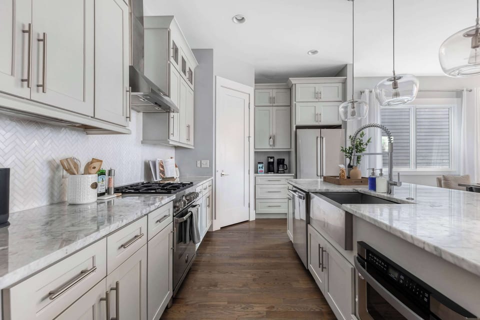 The gourmet kitchen is a chef's dream, featuring top-of-the-line appliances, ample counter space, and high-end finishes for ultimate culinary creativity.