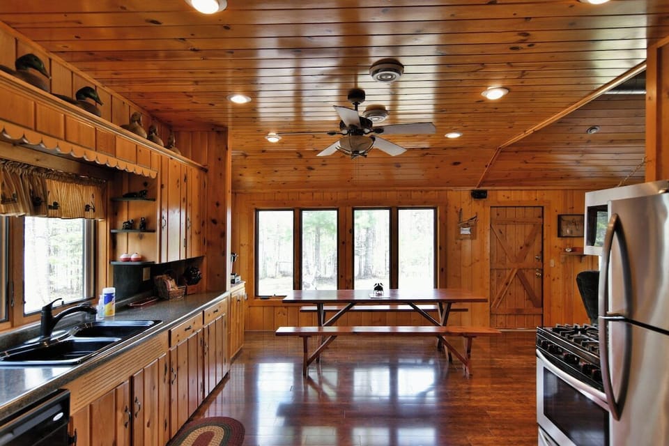 The dining area is pen to the kitchen and facing the lake.