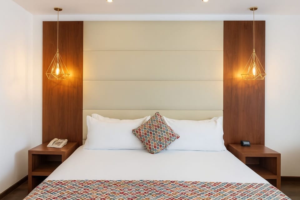 Drift off beneath warm pendant lights and plush pillows.