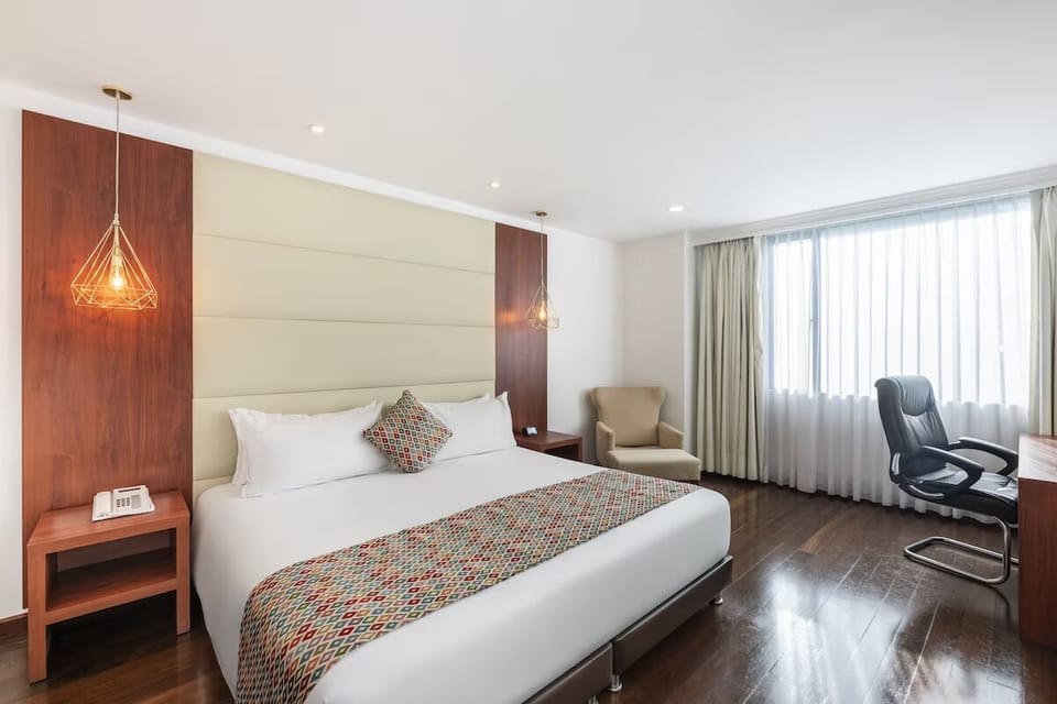 Stretch out on crisp linens beside a sunlit window.