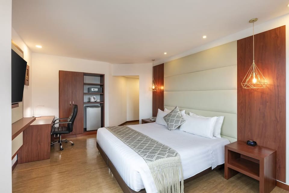 Enjoy extra convenience with workspace, storage, and in-room minibar.
