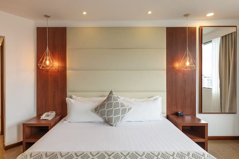 Recharge in a calm, modern room with warm lighting.
