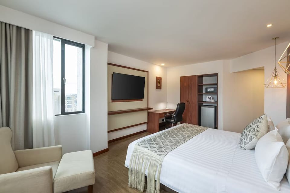 Lounge comfortably with easy TV viewing and window light.