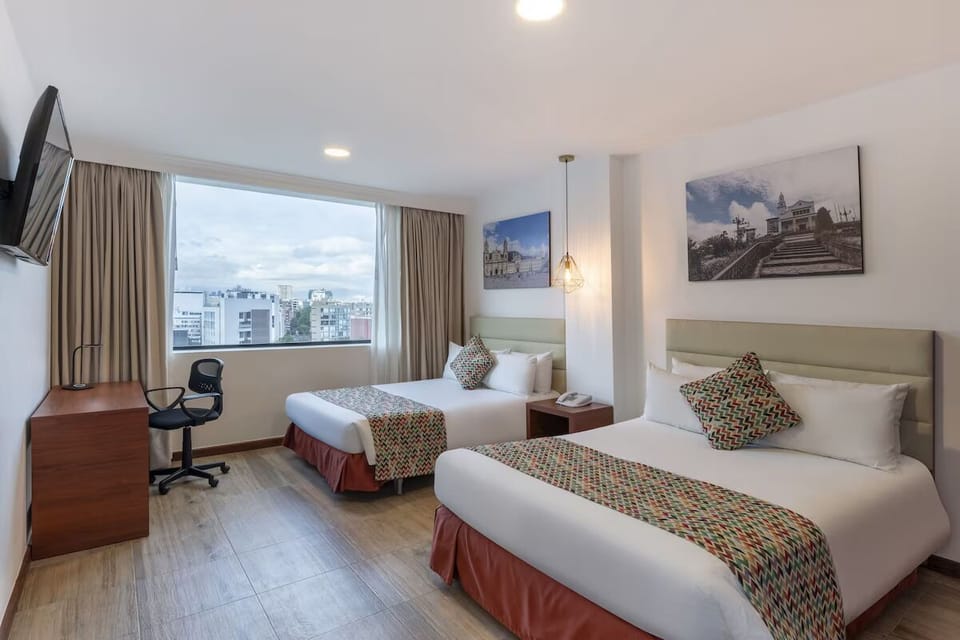 Unwind in crisp twin beds beside sweeping city views.