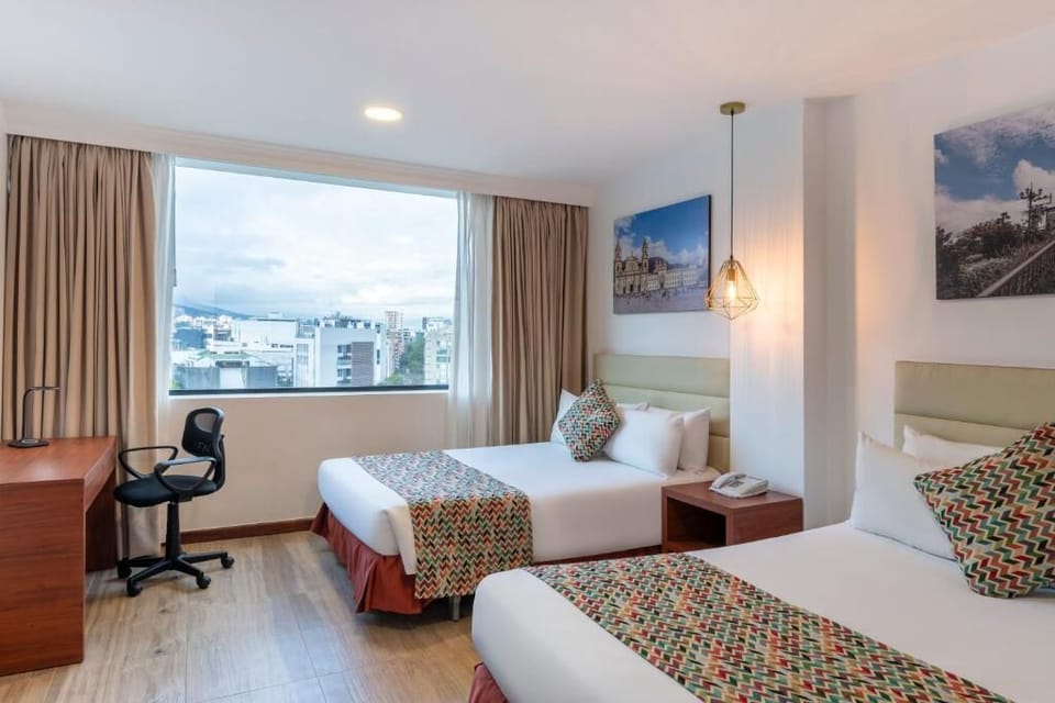 Wake up to daylight pouring through wide city-view windows.