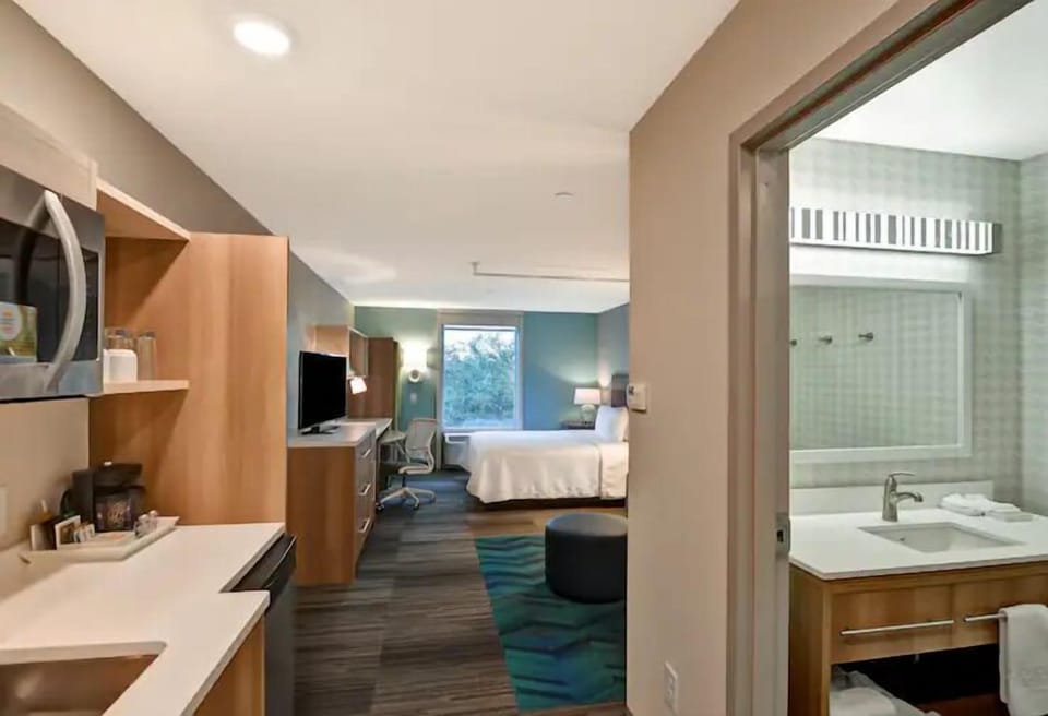 Sip morning coffee near the kitchenette before heading out.