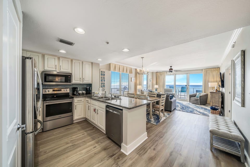 The fully equipped kitchen features granite countertops, stainless-steel appliances, and everything you need to cook meals for family and friends.