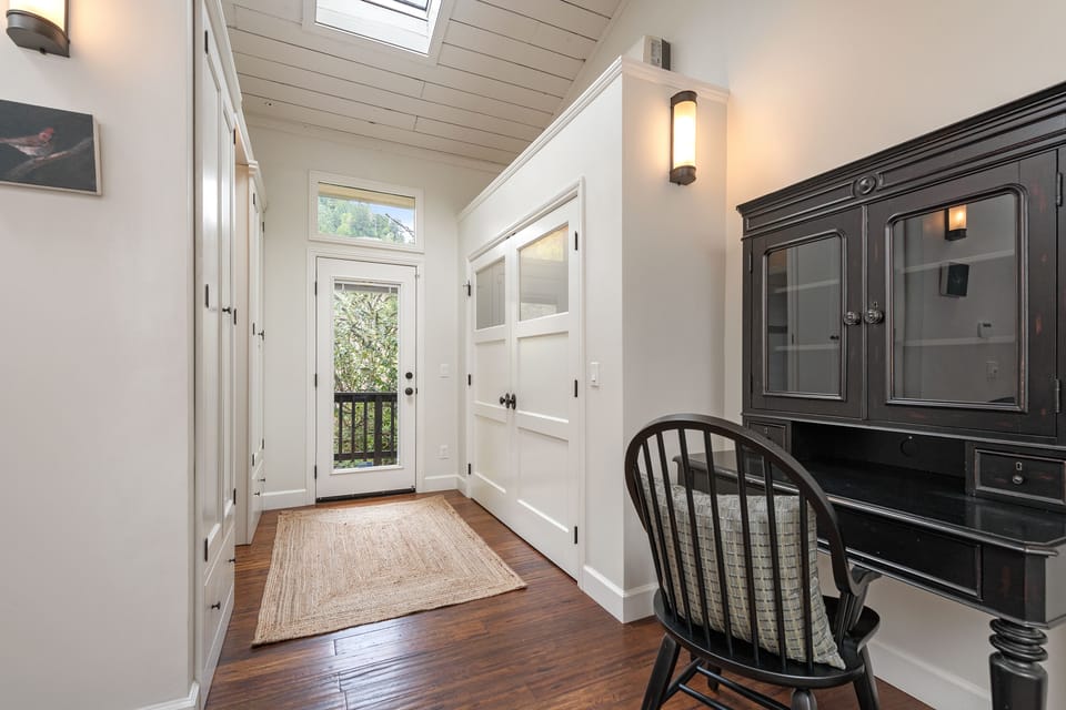 Bring work, if you must - there's a desk in the master suite - and a door to the back deck and hot tub.