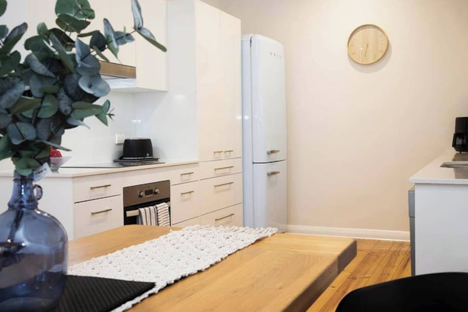 The modern, streamlined kitchen has all you need to prepare meals at home, plus a dishwasher for easy clean-up.  
