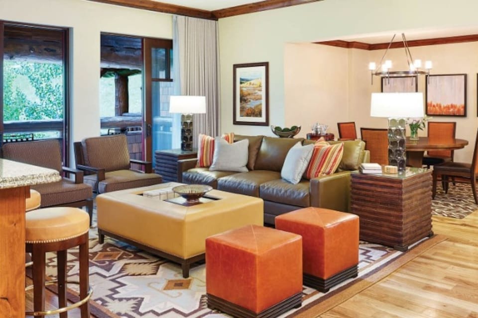 Living Room with fireplace, flat screen TV with direct TV. Living room has a double sofa bed