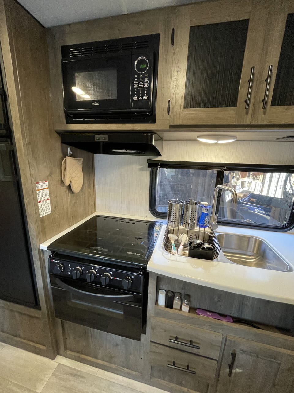 There is a microwave, propane stove and oven available to cook with.