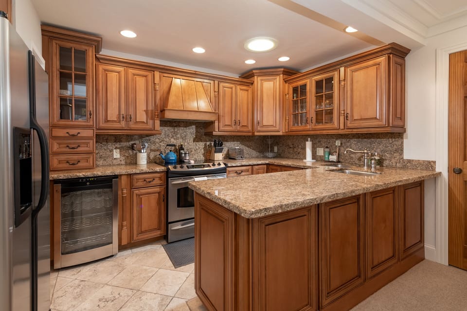 Chefs kitchen stocked with everything including top of the line appliances.