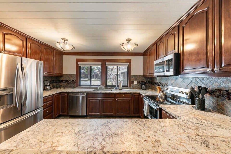 The kitchen area is a highlight of the home, with tons of stainless steel appliances and plenty of room to create your favorite meals for friends and family.
