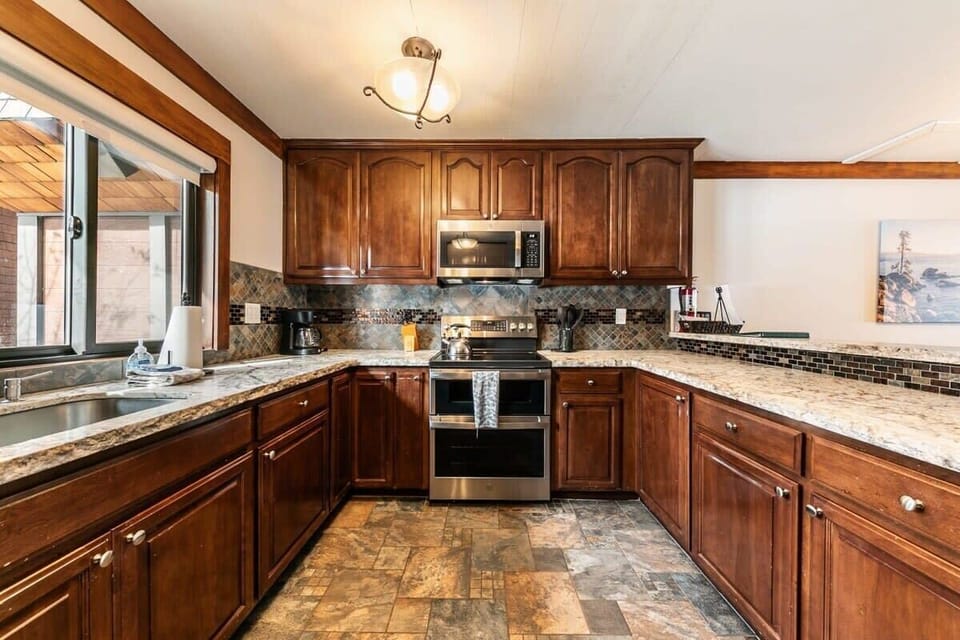 The kitchen area is a highlight of the home, with tons of stainless steel appliances and plenty of room to create your favorite meals for friends and family.