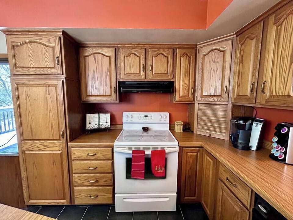 4 burner electric stove and Keurig machine.