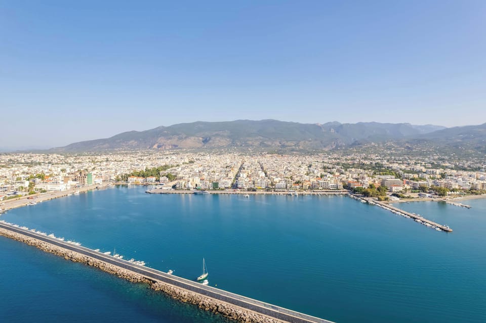 Scenic Aerial of Kalamata’s Marina, City, and Surrounding Mountains