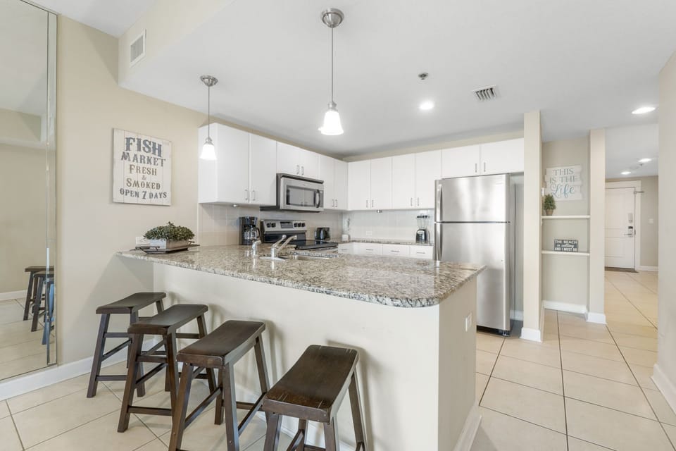 Modern kitchen with granite countertops and stainless steel appliances
