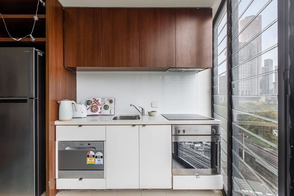 The kitchen area has ample storage, refrigeration, an induction stove, oven, dishwasher and small appliances so you can enjoy cooking and keeping the apartment stocked with your favourite snacks. 
