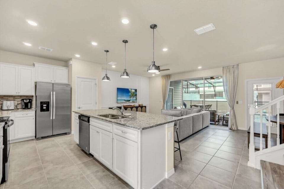 - Gourmet kitchen - large island, stainless steel appliances, and open layout ideal for group cooking  