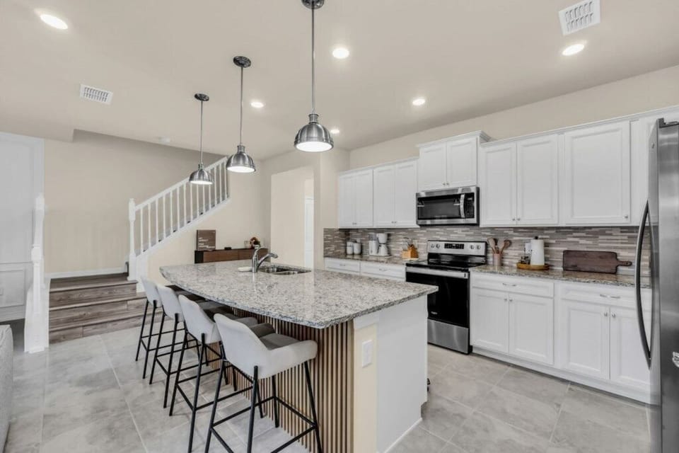 - Bright breakfast bar - stylish pendant lights and seating for casual family dining  