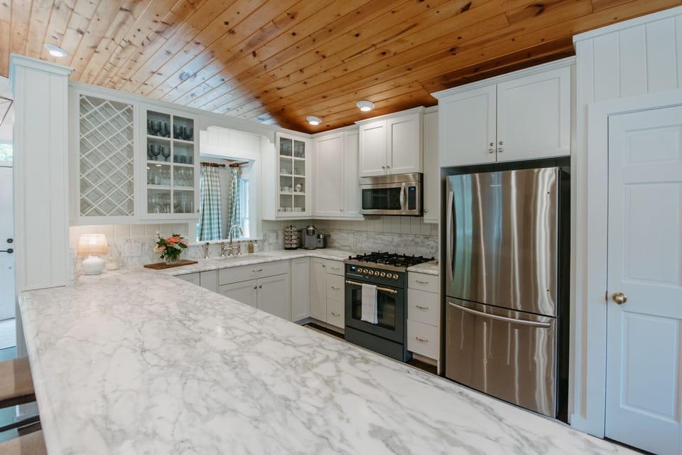 Kitchen featuring marble countertops 