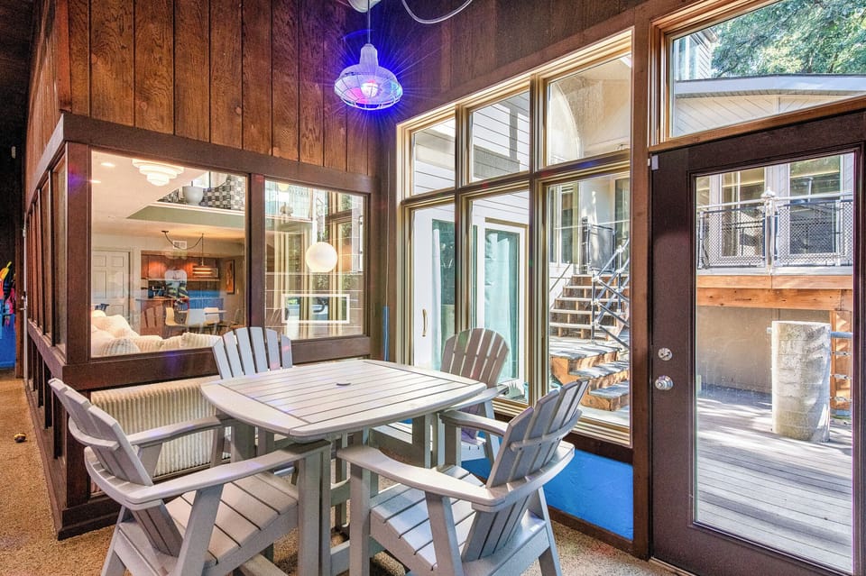 Your bright dining space opens to a peaceful deck, perfect for morning coffee or evening meals with garden views.